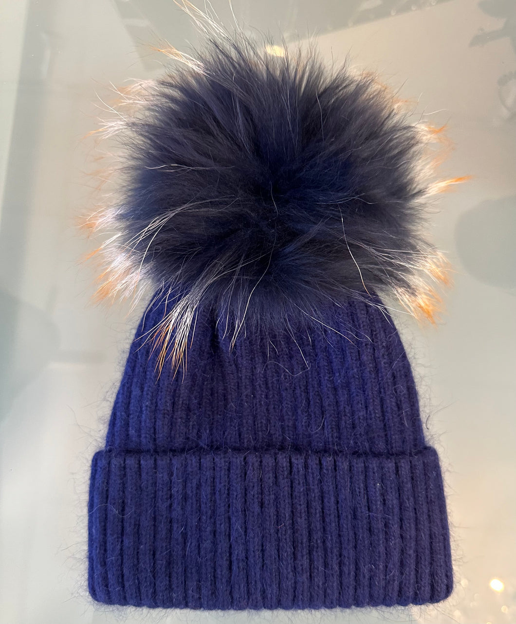 Linda Richards Navy Hat with Navy Fur Pom with White and Orange Tips